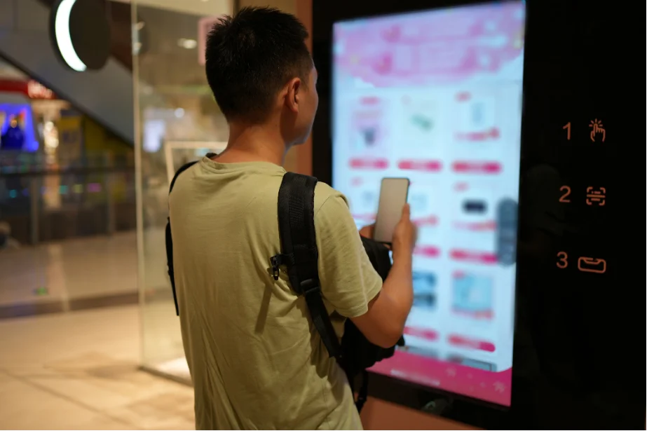 A man using the vending mechines